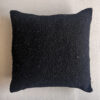 Black square wool cushion, shown from the front.