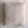 Natural White square wool cushion, shown from the front.