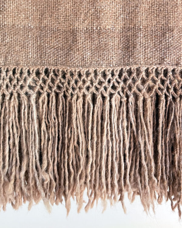 Fringe detail of the Llama Throw – Oat in undyed beige llama fiber.
