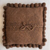 Chocolate Brown square cushion with handmade pom poms, shown from the back.