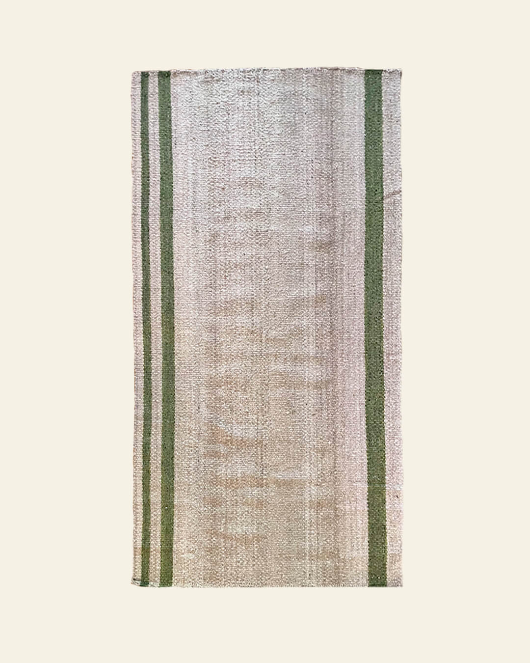 Handwoven wool rug by ANDINA in Sand with Moss green stripes, made on traditional looms.