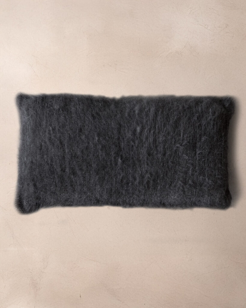 Handwoven llama lumbar pillow in Black undyed deep pile, top view