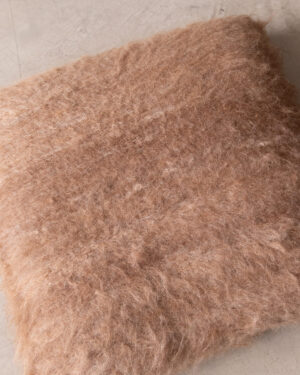 Macro detail of the undyed Camel llama fiber’s brushed pile texture