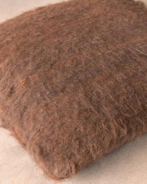 Handwoven llama cushion in Chocolate undyed deep pile, top view