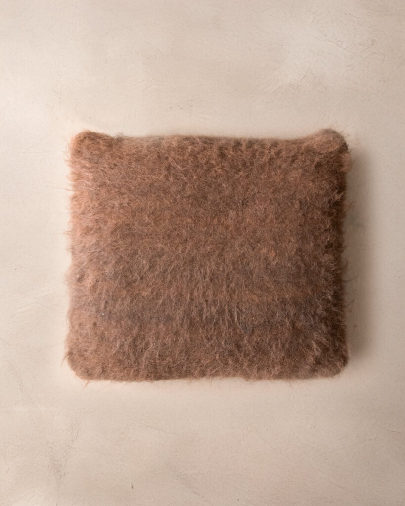 Square llama cushion in Chocolate showing its even brushed pile across the full surface