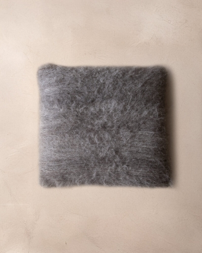 Handwoven llama throw pillow in Shadow undyed deep pile, top view