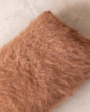 Close-up of the Oak llama lumbar cushion’s folded edge, showing its brushed pile texture