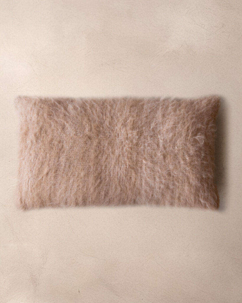 Handwoven llama lumbar cushion in Oat undyed deep pile, top view