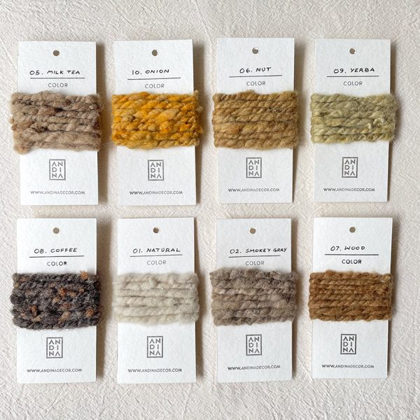 Pack of 16 handwoven color samples on cardboards presented on a white background.